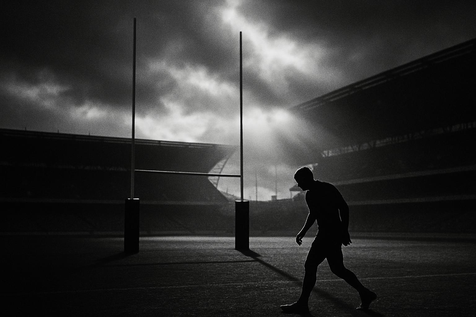 Grayscale editorial illustration: At Eden Park, The All Blacks Turn Field And Fear Into A System