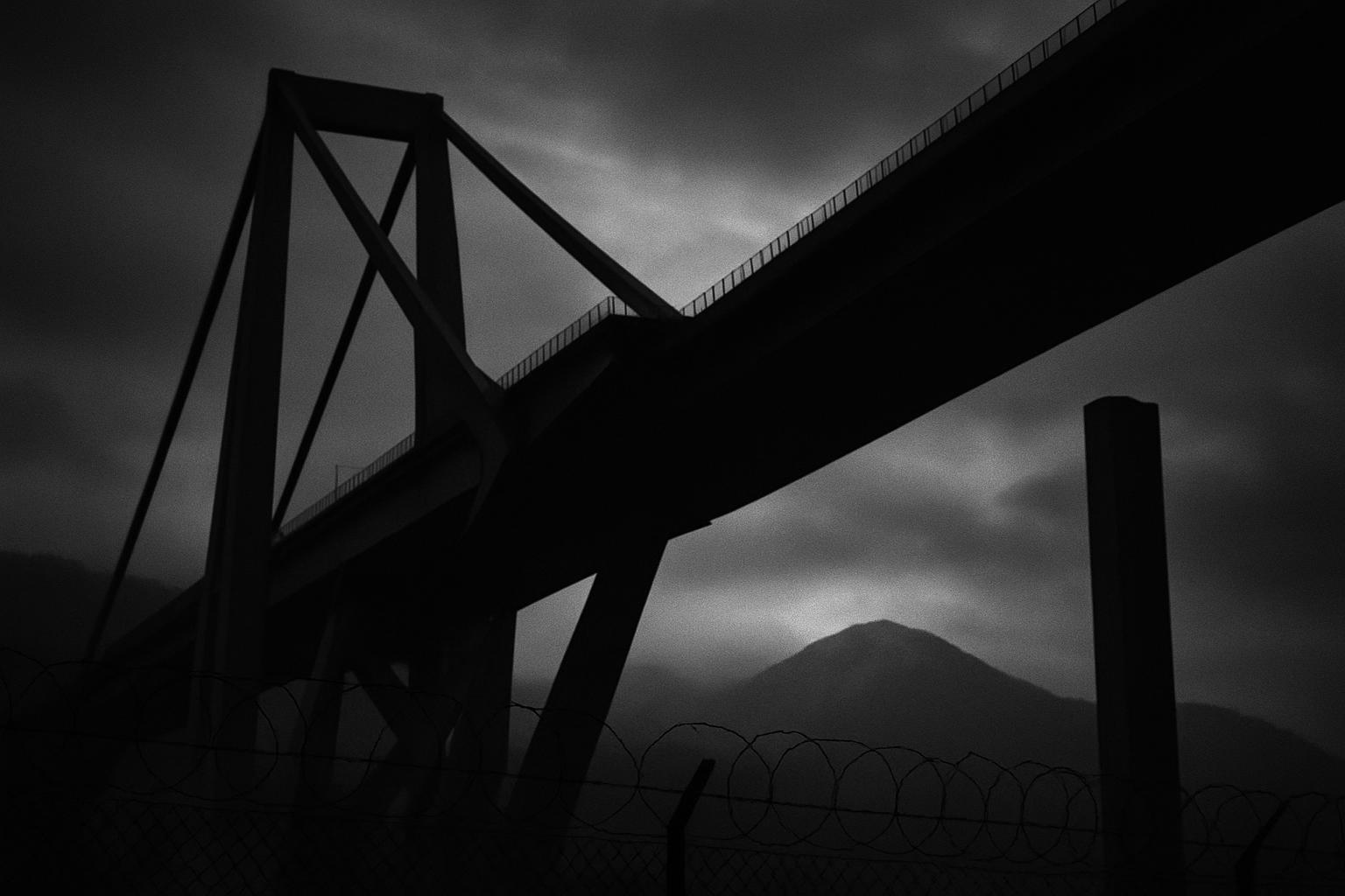Grayscale editorial illustration: Genoa Bridge Verdict Puts Italy's Concession Model Under Judicial Scrutiny