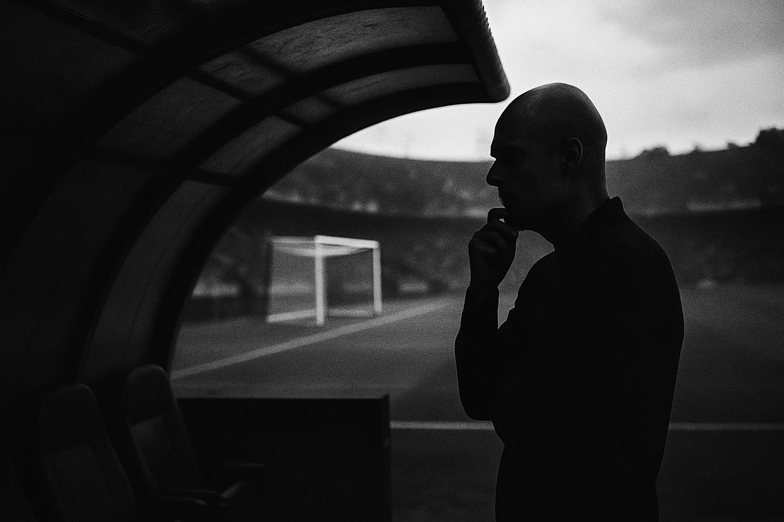 Grayscale editorial illustration: Italy Weighs Flexibility For Guardiola As The Arms Race Hits The Dugout